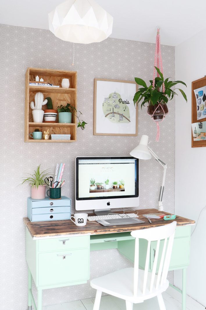 a workspace with plants desk